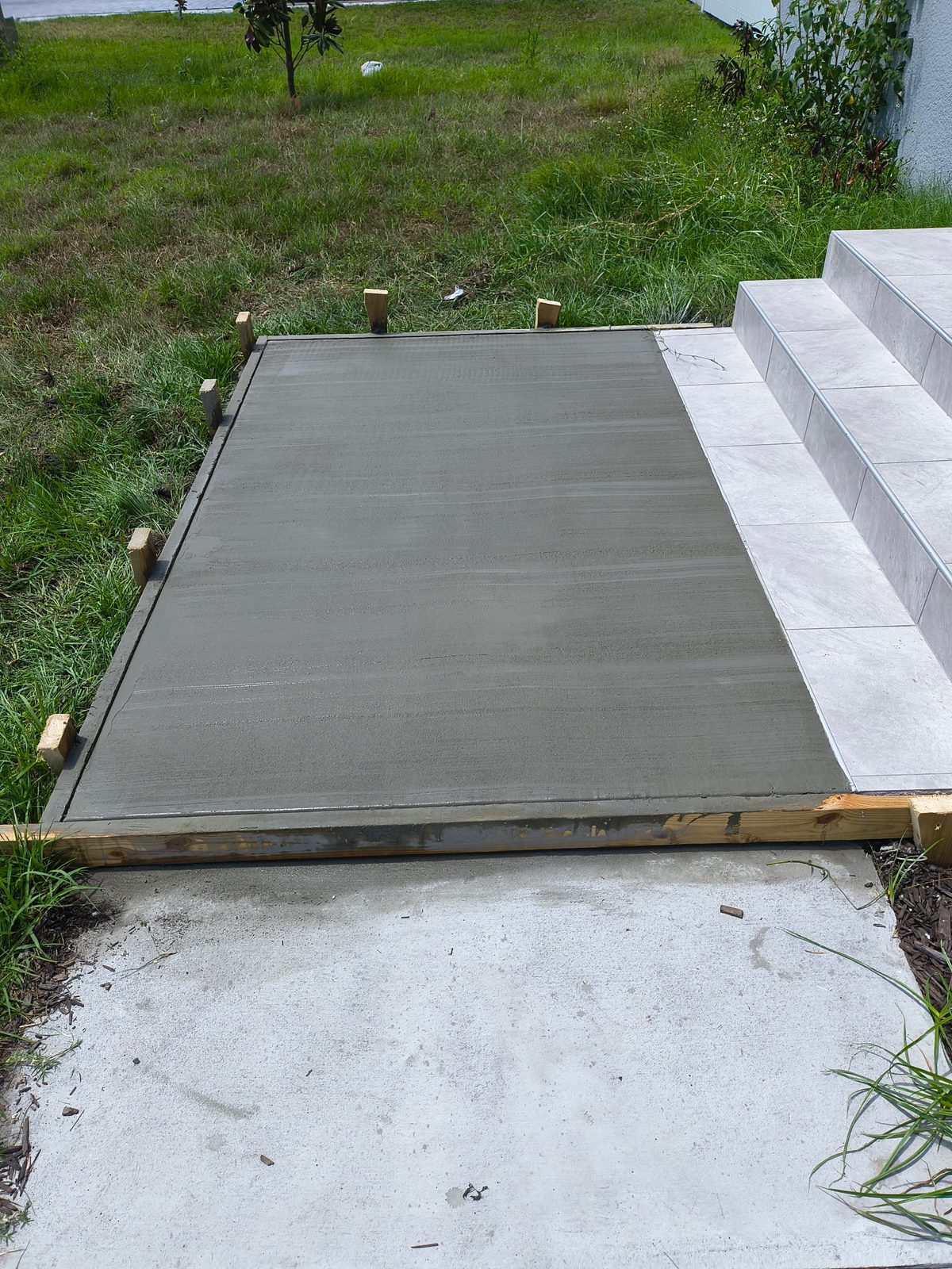 Formed and finished concrete pad