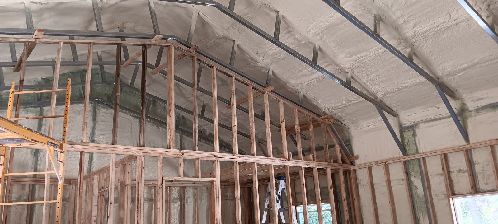 Custom vaulted ceiling framing in metal and wood